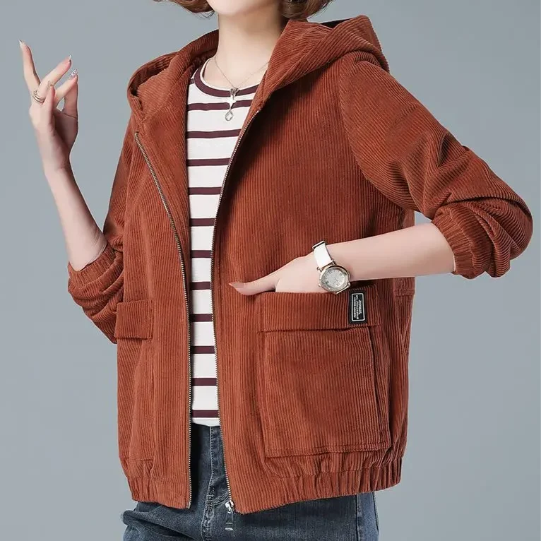 Close-up of ribbed corduroy texture and zip-front detail on women's jacket