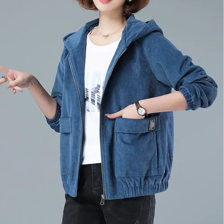 Side profile of corduroy hooded jacket showing relaxed silhouette and patch pocket