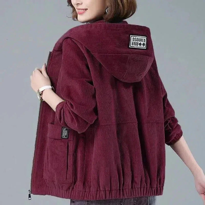 Corduroy hooded jacket in rust showing soft ribbed fabric texture