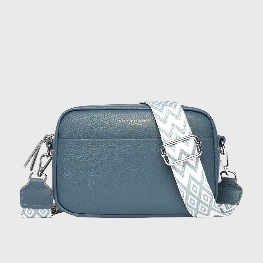 Women's crossbody bag with contrasting geometric strap and silver-tone hardware detailing