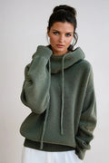 Women's hooded knit jumper in sage green with drawstring detail and relaxed fit