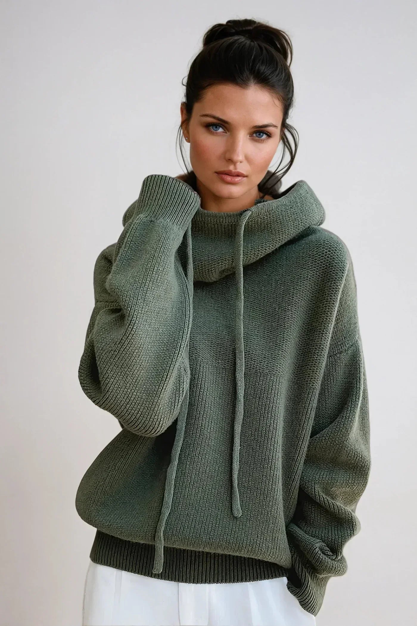 Women's hooded knit jumper in sage green with drawstring detail and relaxed fit