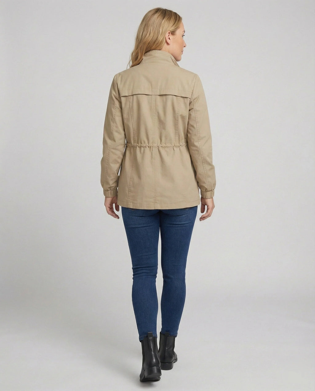 Front view of relaxed utility jacket featuring full-length zip closure and flap pockets