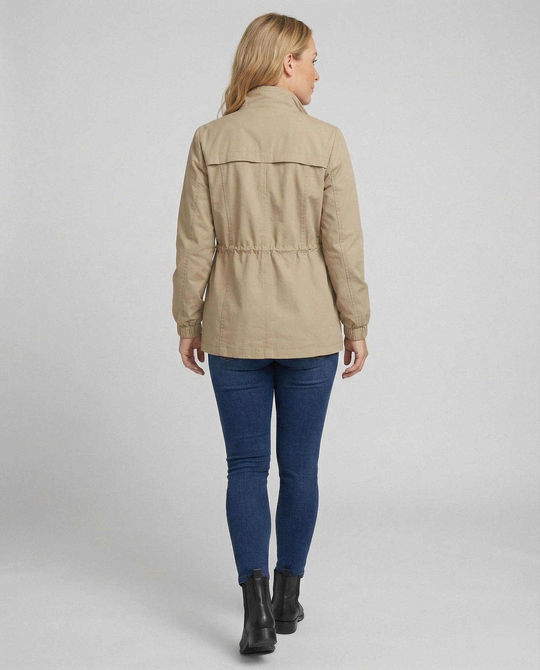 Front view of relaxed utility jacket featuring full-length zip closure and flap pockets