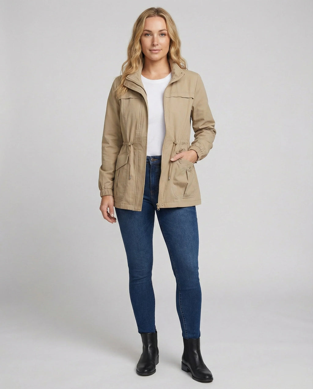 Close-up of drawstring waist detail on women's casual utility jacket with adjustable cord