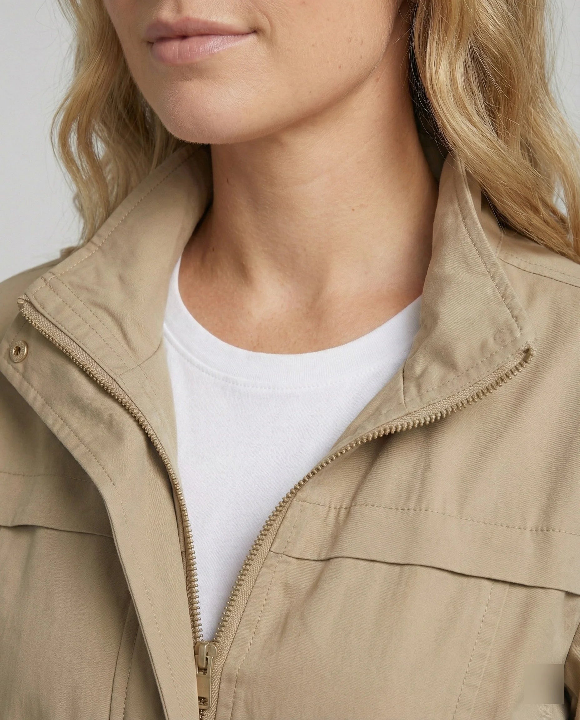 Side profile showing structured silhouette of women's utility jacket with elasticated cuffs