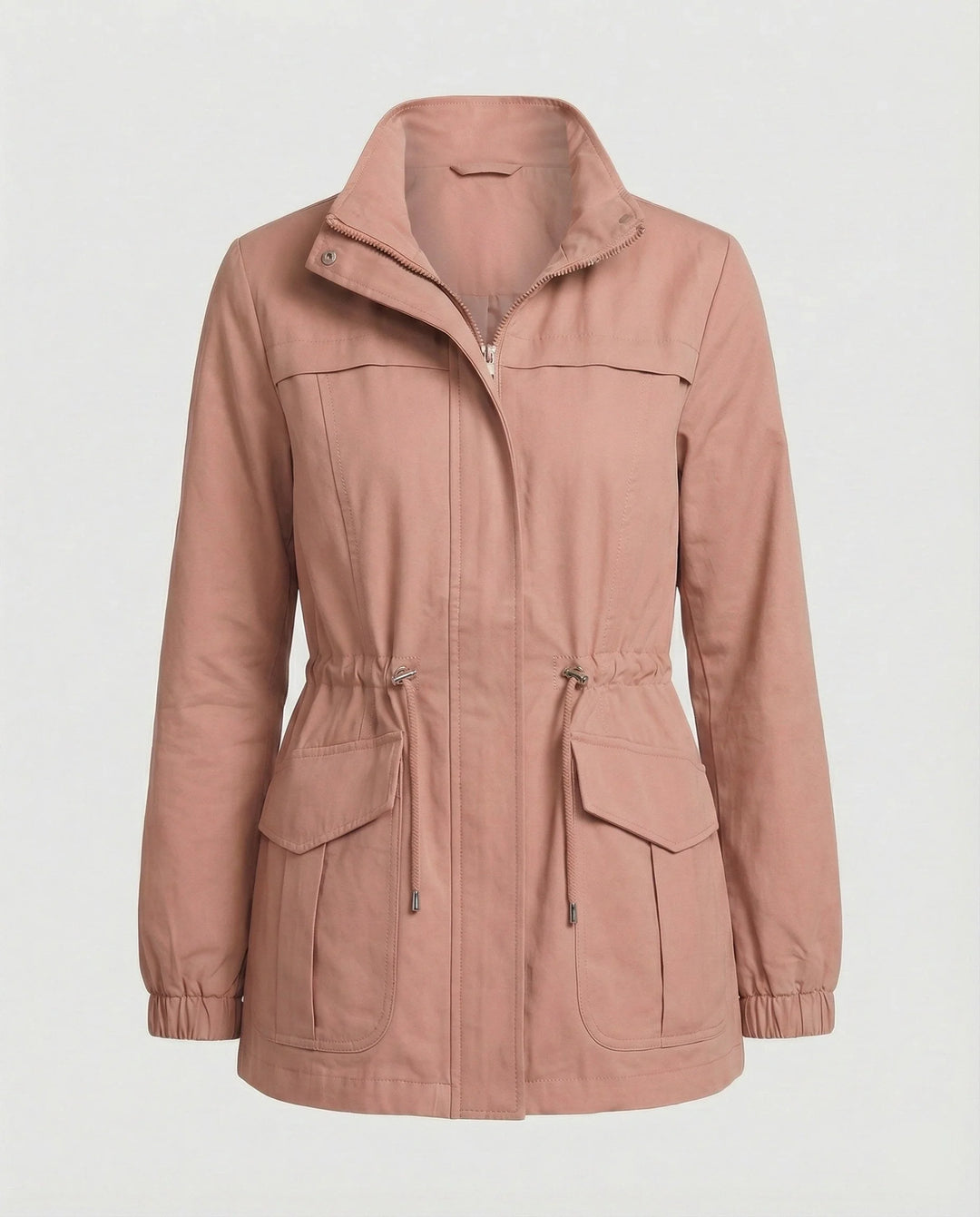 Full-length view of women's utility jacket in khaki paired with jeans and boots