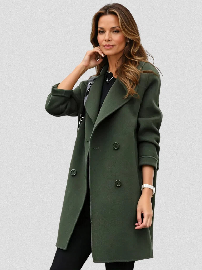 Women's double-breasted longline coat in army green with notched lapels and knee-length silhouette worn over black outfit