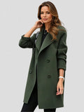 Women's double-breasted longline coat in army green with notched lapels and knee-length silhouette worn over black outfit