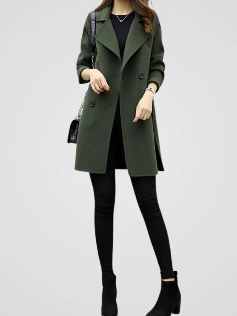 Close-up of double-breasted button fastening and sharp notched lapels on women's coat