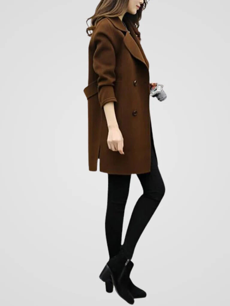 Detail of turned-back cuffs and long sleeves on women's double-breasted coat