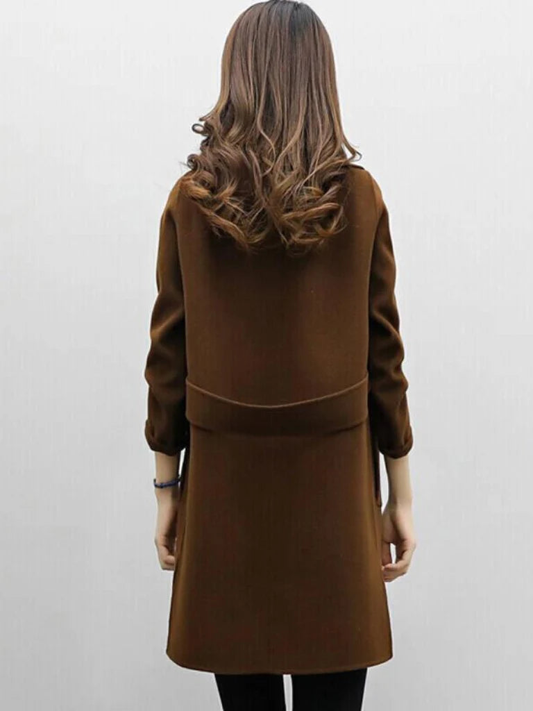 Women's longline coat in brown colourway showing double-breasted front and notched lapels