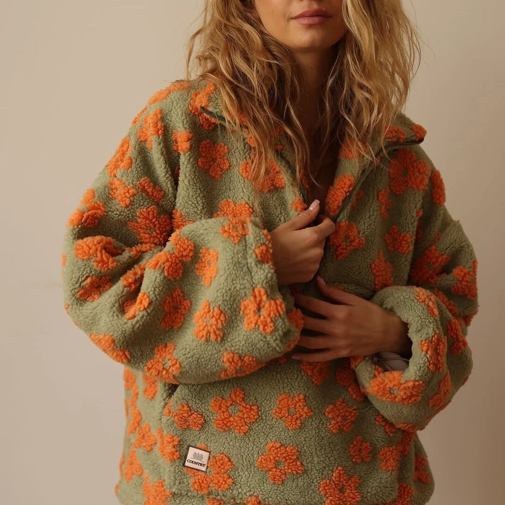 Back view of oversized women's fleece jacket with all-over daisy print pattern