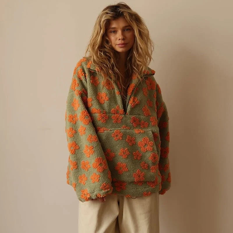 Women's floral fleece jacket showing wide sleeves and roomy fit for comfortable layering