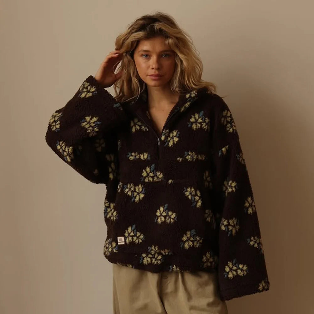 Women's oversized floral fleece jacket with half zip worn casually over casual outfit
