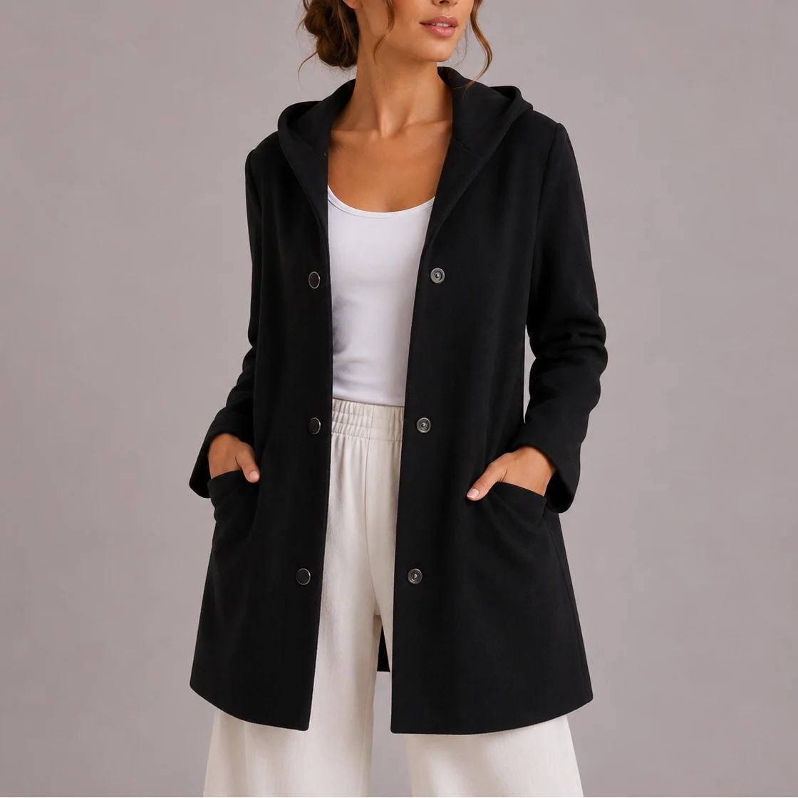 Side view of women's hooded jacket with mid-thigh length and relaxed silhouette