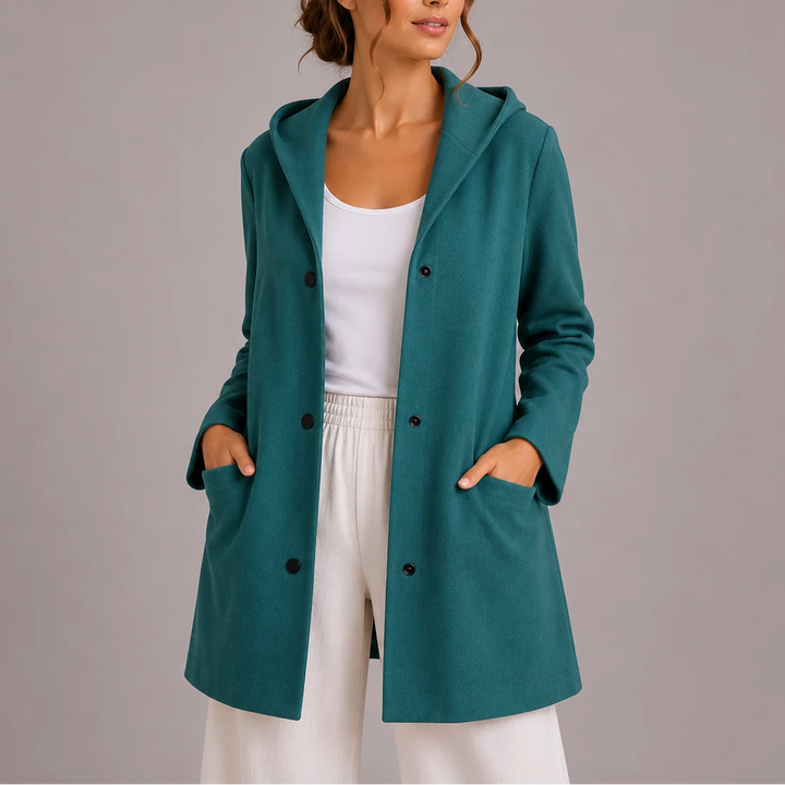 Detail of patch pockets and double-breasted button front on hooded jacket