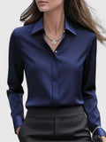 White relaxed fit shirt displaying smooth woven fabric and tailored collar construction