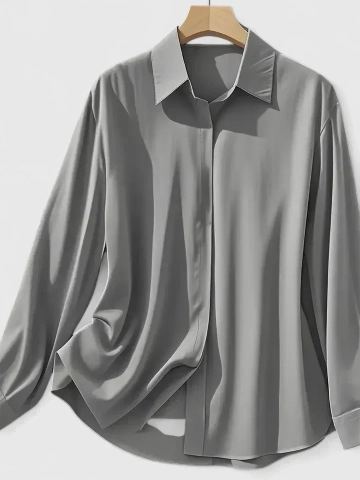 Close-up view of relaxed fit shirt showing lightweight woven fabric and curved hem detail