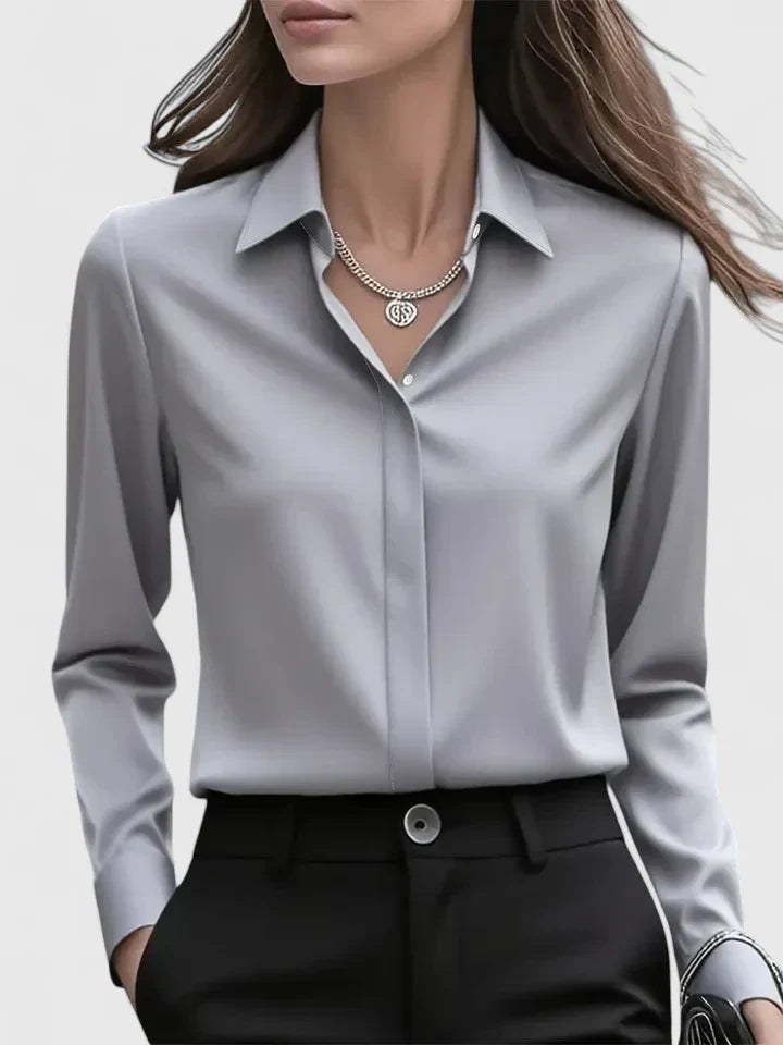 Women's classic collar shirt in white showing button cuff detail and sleeve drape