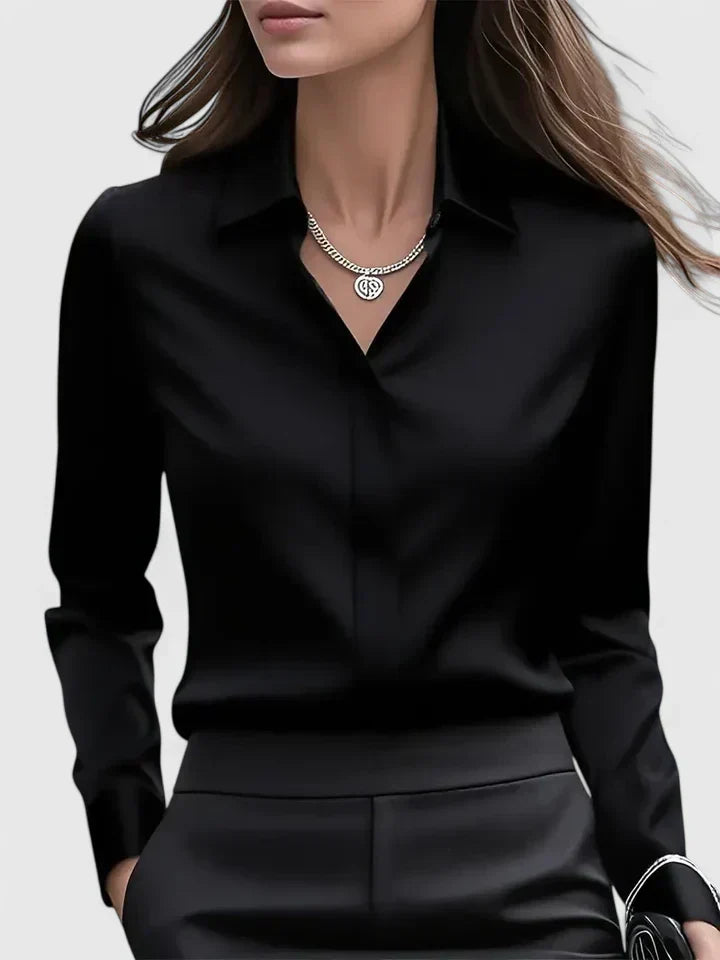 Front view of women's shirt with hidden buttons and structured collar design