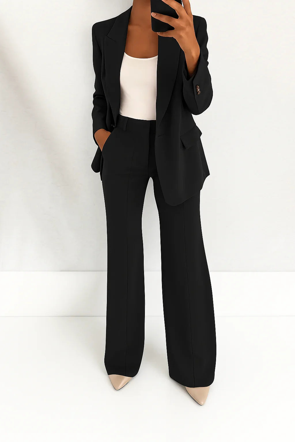 Women's tailored blazer and wide leg trouser suit set in black with structured fit
