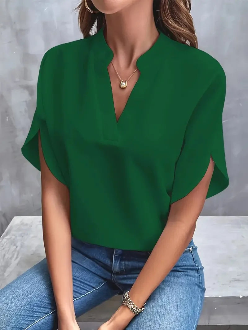 Side view of relaxed fit blouse showing flutter sleeve and hip-length cut
