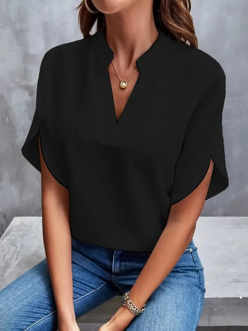 Women's blouse styled with denim trousers for smart casual everyday wear