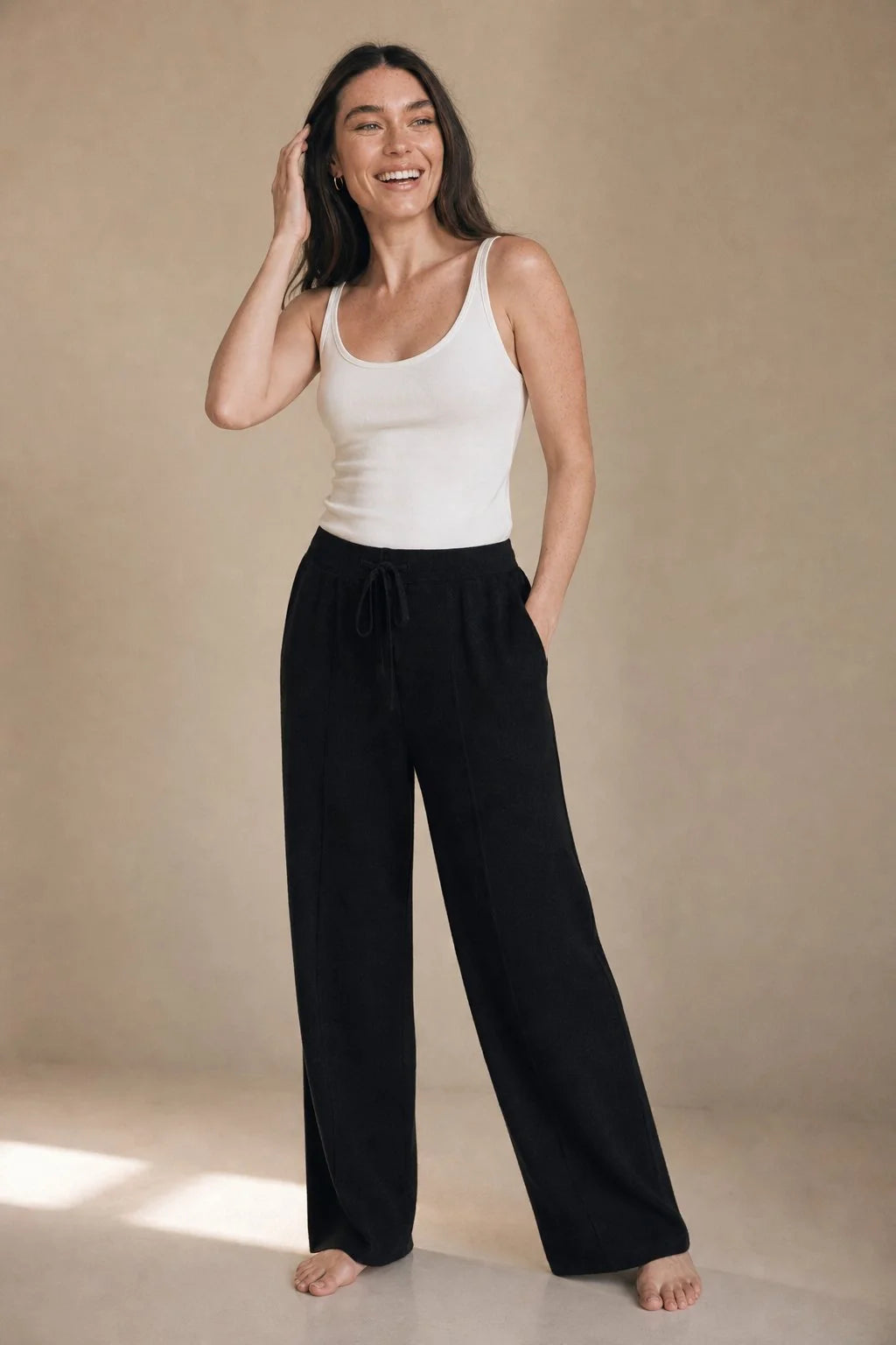 Detail of wool trousers waistband featuring elasticated back and drawstring closure