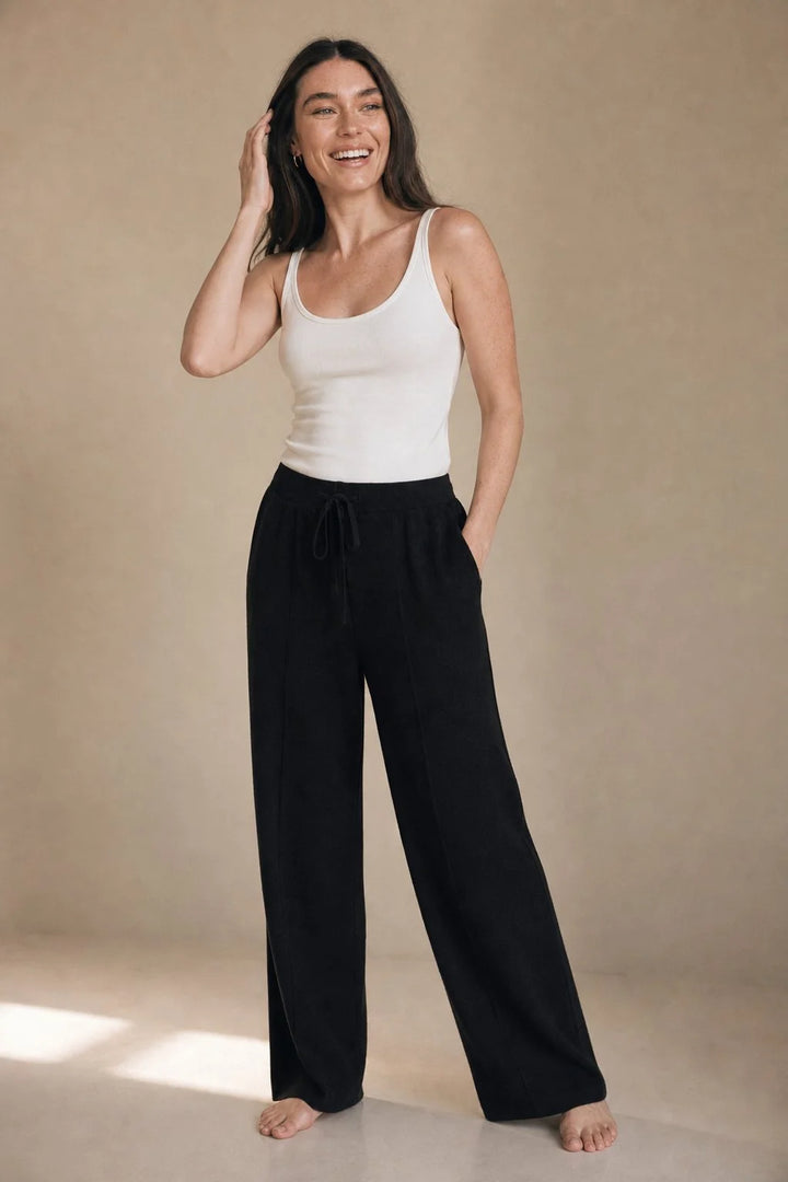 Detail of wool trousers waistband featuring elasticated back and drawstring closure