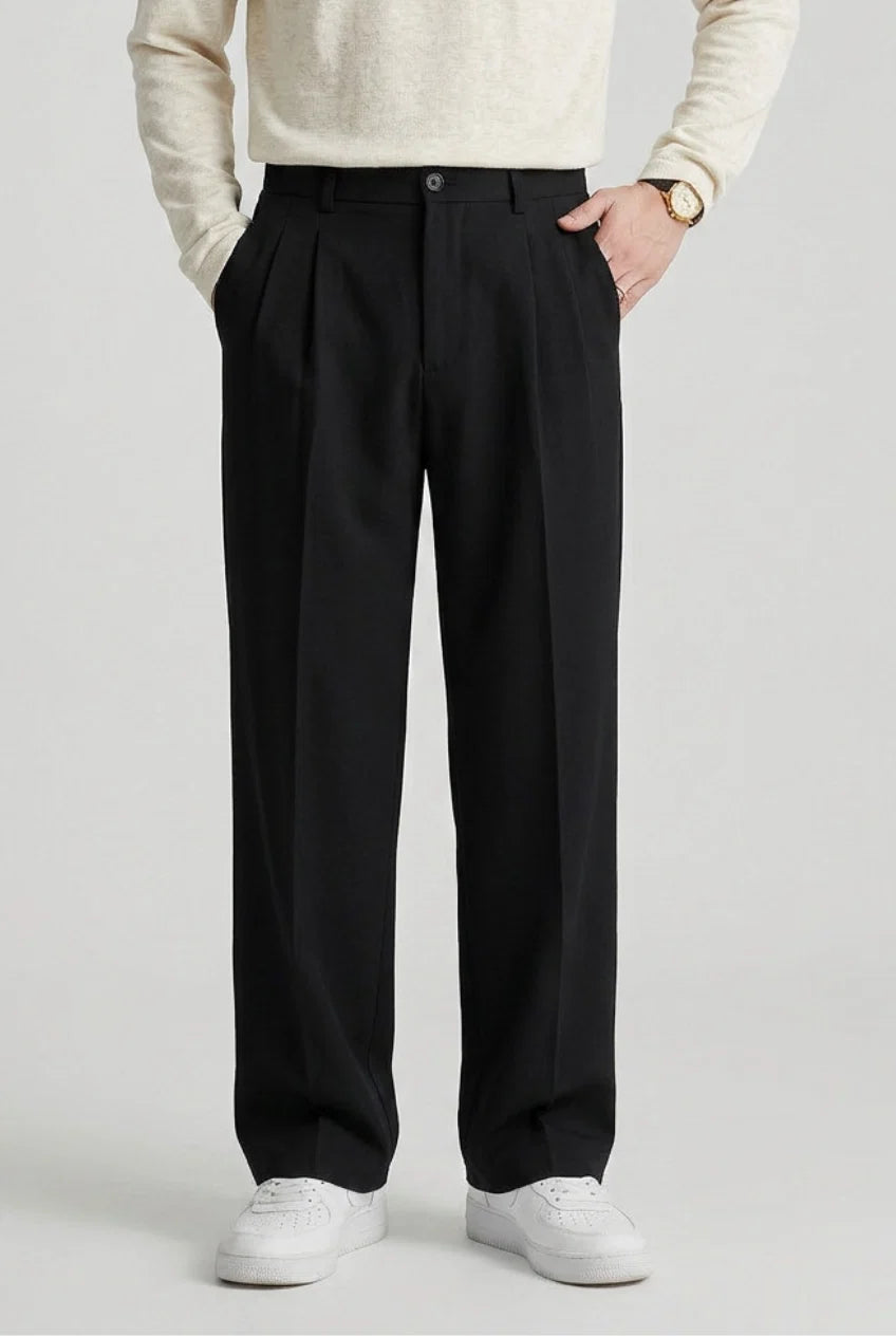 Men's high waist pleated trousers in black with straight leg silhouette and tailored fit