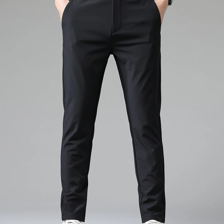 Side view of men's slim fit trousers showing clean lines and structured fabric drape