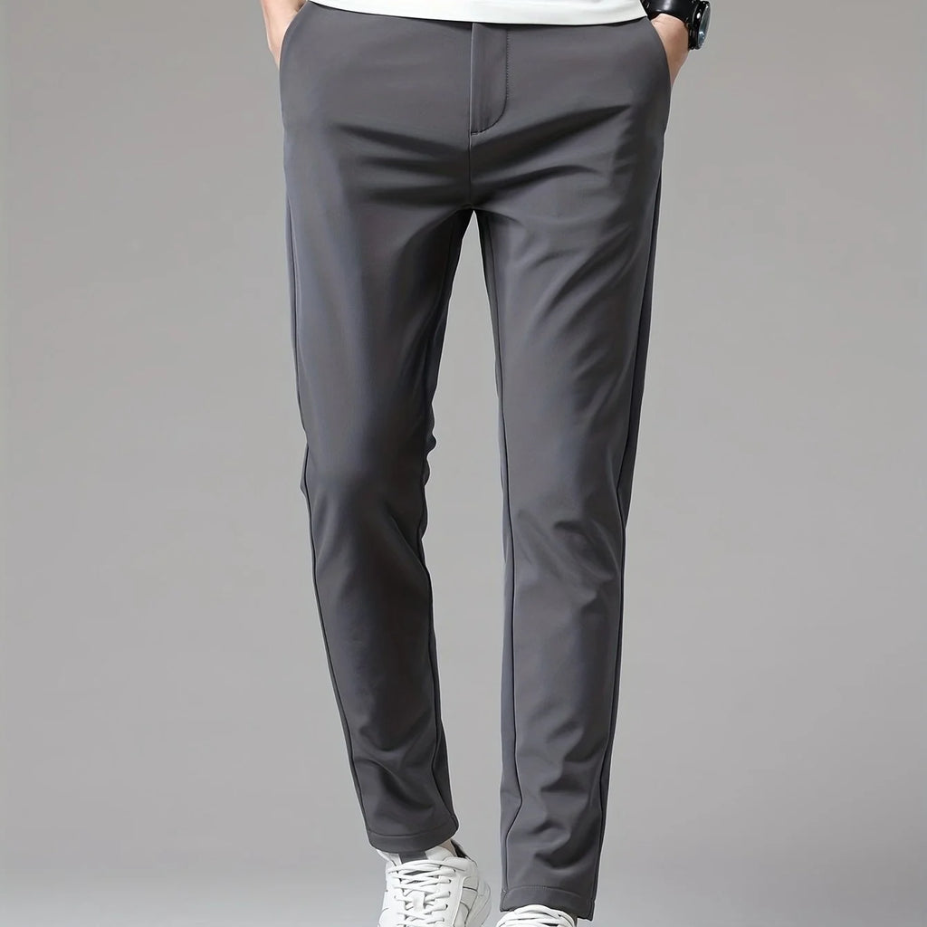 Full-length shot of men's slim fit trousers demonstrating versatile straight leg cut