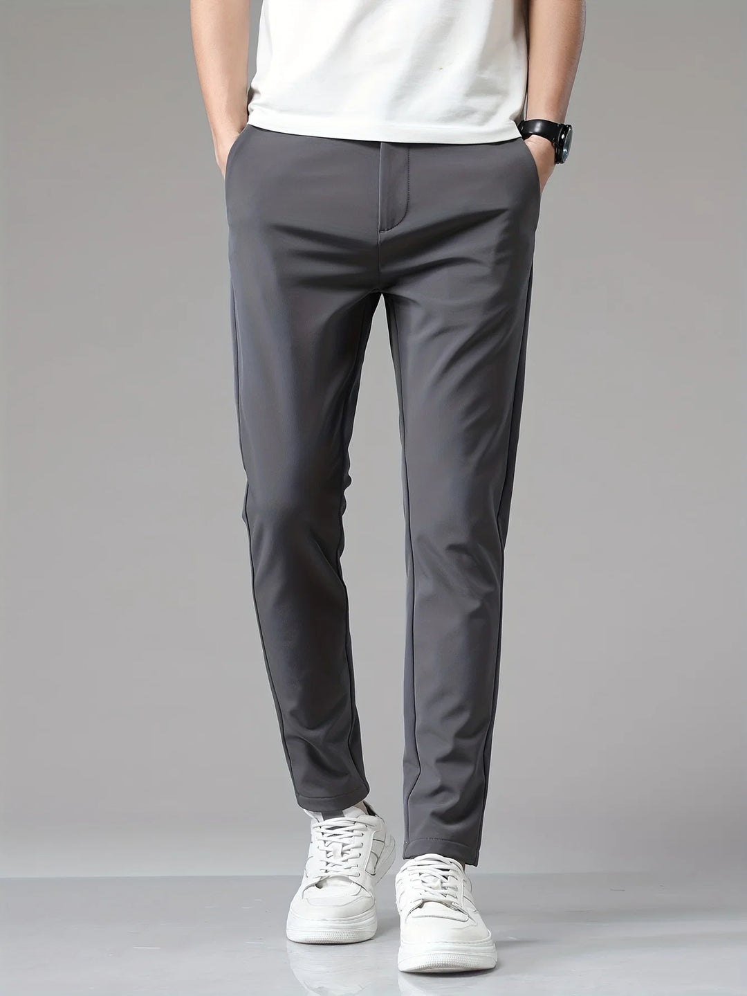 Side profile of men's navy trousers displaying slim fit silhouette and clean straight leg cut