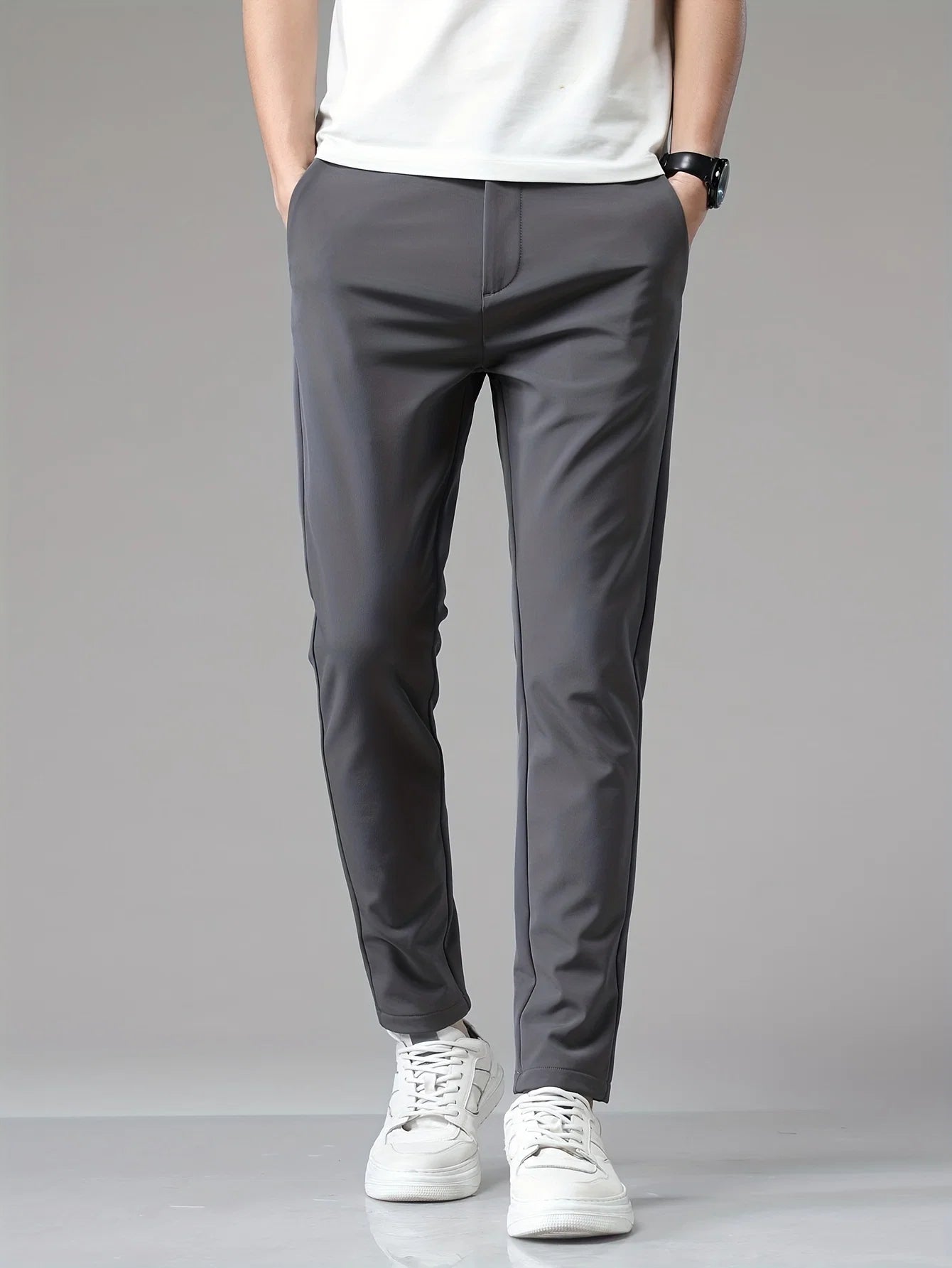 Side profile of men's navy trousers displaying slim fit silhouette and clean straight leg cut