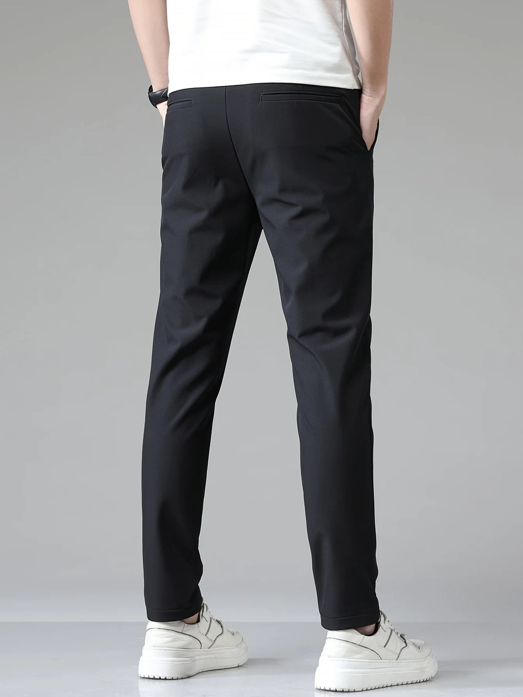 Close-up of men's trousers fabric showing smooth woven finish with gentle stretch