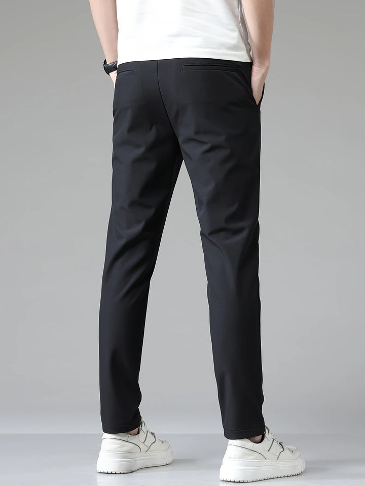 Close-up of men's trousers fabric showing smooth woven finish with gentle stretch