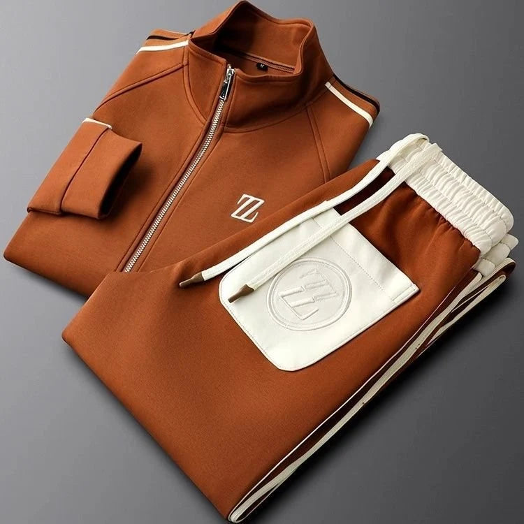 Close-up view of men's tracksuit jacket showing stand collar, zip closure, and side stripe trim detail