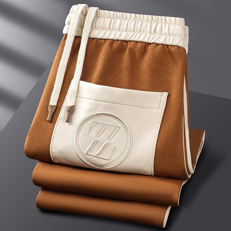 Men's tracksuit joggers with elasticated drawstring waist and bold side stripe running down the leg