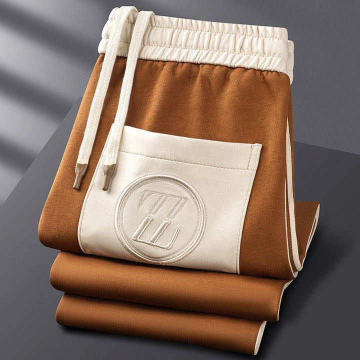 Men's tracksuit joggers with elasticated drawstring waist and bold side stripe running down the leg