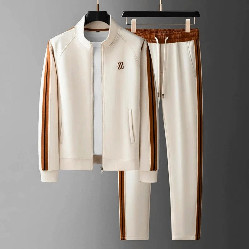 Men's tracksuit joggers showing tapered leg, ribbed cuffs, and side stripe design on neutral background
