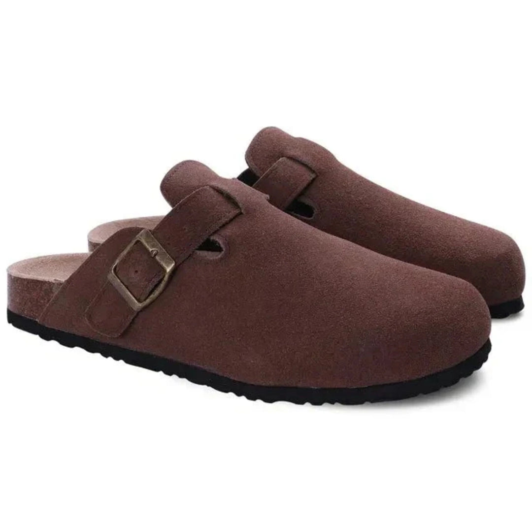 Detail of adjustable metal buckle strap on men's clogs with contoured footbed support