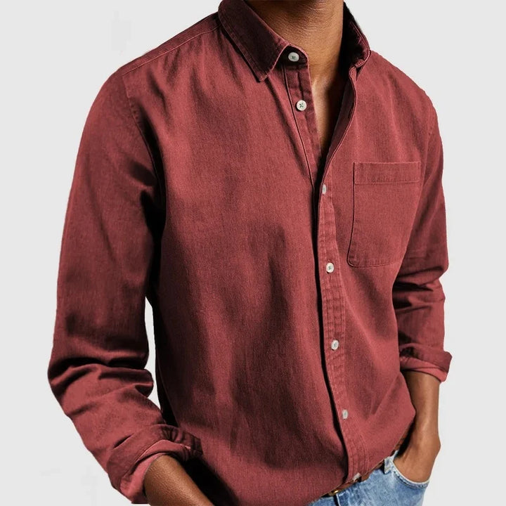 Relaxed men's denim shirt with structured fabric and classic button front