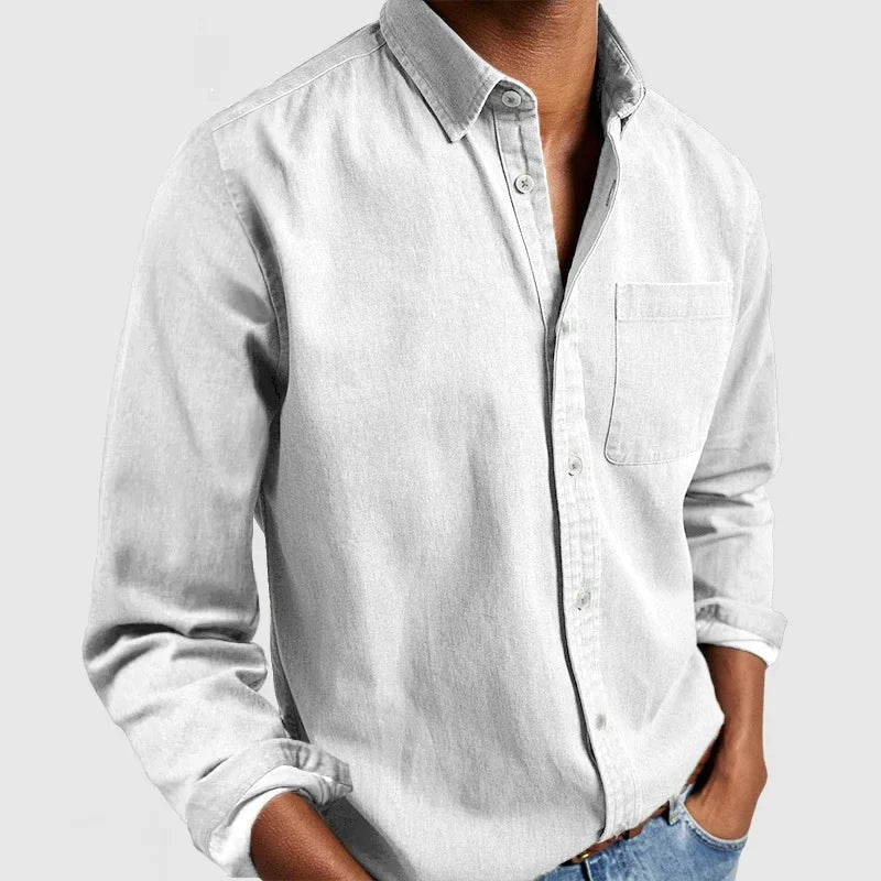 Men's casual denim shirt with long sleeves and button-down collar styling