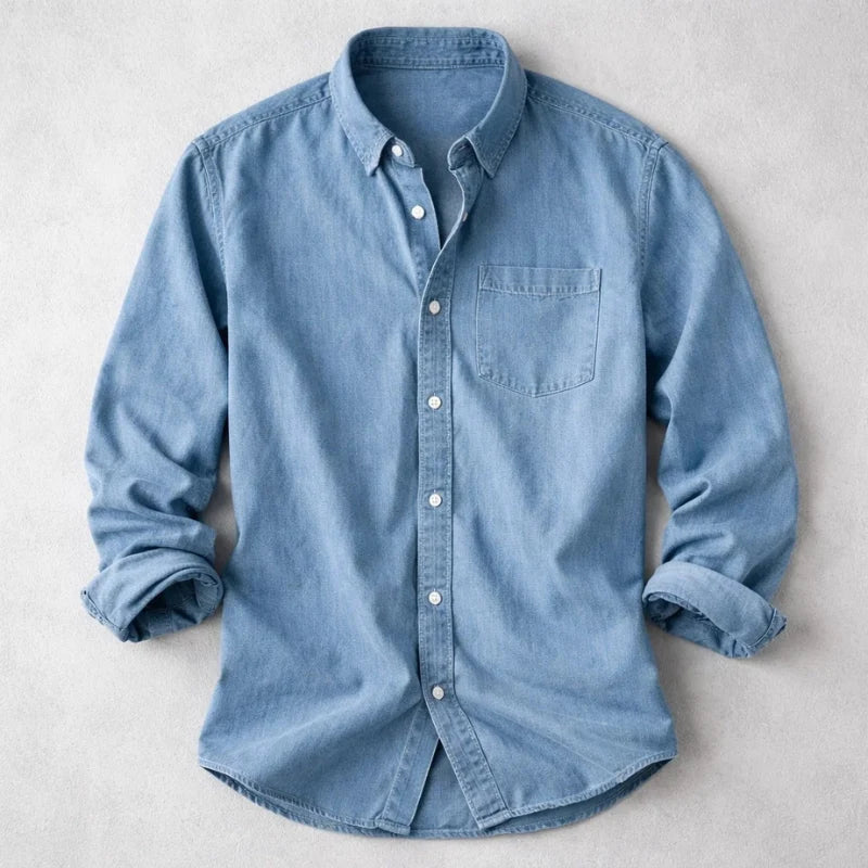 Light blue men's denim shirt with chest pocket and relaxed fit detail
