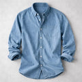 Light blue men's denim shirt with chest pocket and relaxed fit detail