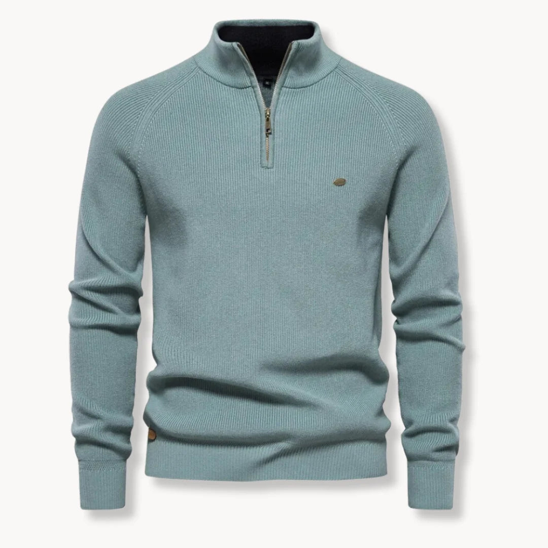 Detail shot of contrast inner collar and zip closure on men's knit jumper