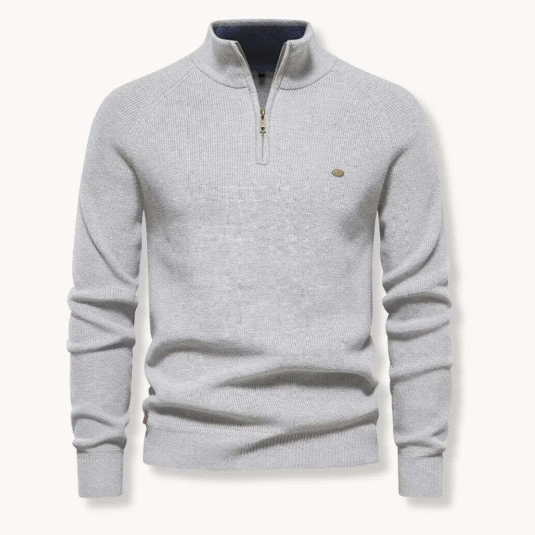 Men's half-zip jumper styled for smart-casual wear showing structured ribbed fabric