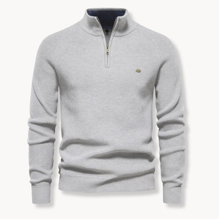 Men's half-zip jumper styled for smart-casual wear showing structured ribbed fabric