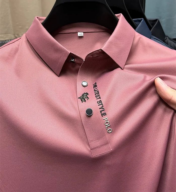 Charcoal grey polo shirt with classic collar and embroidered logo on chest